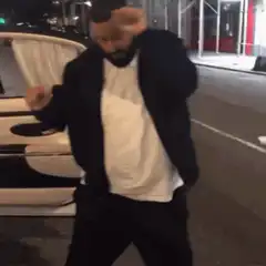 DJ Khaled dancing on the street