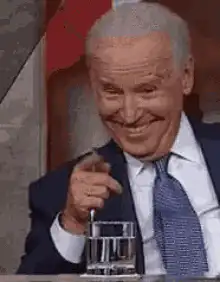 Joe Biden smiling and pointing