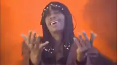 Snoop Dogg dancing with hands up