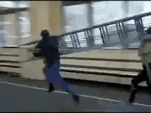 Man climbs ladder on stage