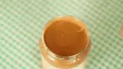 Finger poking peanut butter
