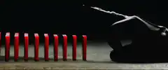Red dominoes form V for Vendetta symbol