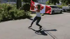Woman running with Canadian flag