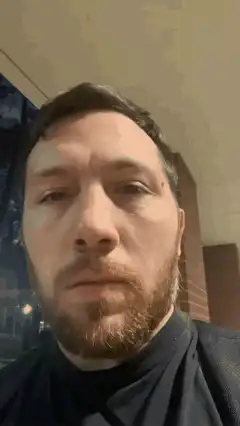 Man looking up with a blank stare