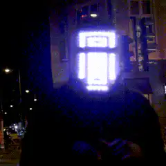 LED mask man dancing on street