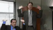 Michael Scott and Dwight Schrute waving hands