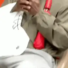 Man with red bottle in sleeve shocked by phone