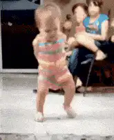 Toddler dancing in a onesie