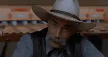Old man tips hat