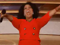 Oprah Winfrey excited red suit