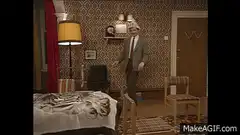 Headless man dancing in bedroom
