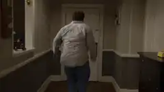 man crashes through door