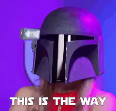 Woman in Mandalorian helmet nodding