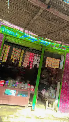 Colorful roadside shop with thatched roof