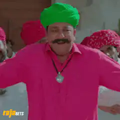 Man in green turban dancing