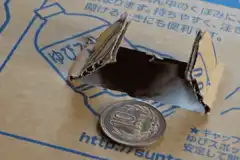Cotton ball pops out of cardboard