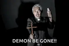 Priest holding cross demon be gone