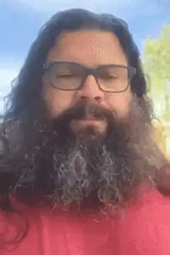 Man with long beard and glasses