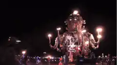 Giant fire octopus robot at night