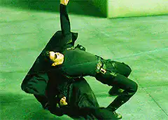 Agent Smith dodging green laser
