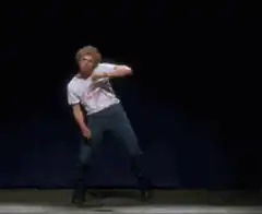 Blond man doing karate moves