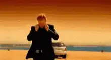 Man walks away from exploding car