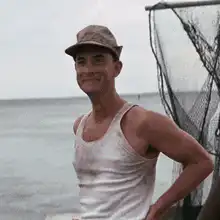 Man in tank top waves