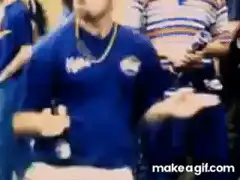 Man in blue shirt dancing