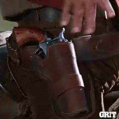 cowboy draws gun from holster