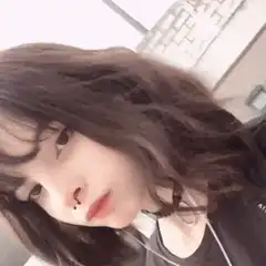 Girl in black shirt tilts camera