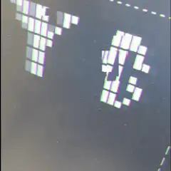 pixelated text scrolling on screen