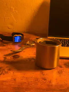 Smartwatch screen lights up on desk
