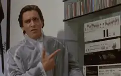 Brian pointing at stereo equipment