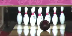 Bowling ball hits pins with pink overlay