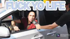 Man in car gives middle finger to interviewer