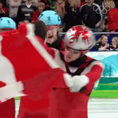 Speed skater celebrates with Canadian flag