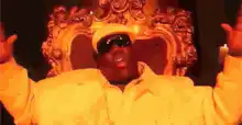 Biggie Smalls sitting on a throne