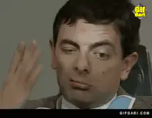 Mr. Bean winking and sticking tongue out
