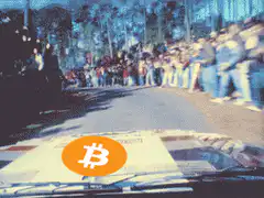 Bitcoin rally car driving past crowd