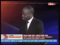 News anchor looks down