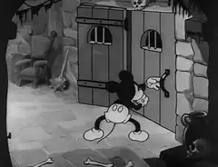 Mickey Mouse opens a dungeon door