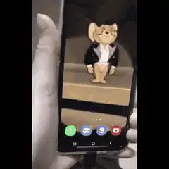 Jerry Mouse dancing on phone screen