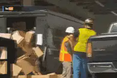 Delivery truck unloads boxes