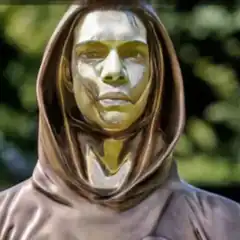 Bronze hooded statue with green face
