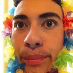 Man in flower lei making surprised face