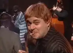 Elton John gives an okay sign