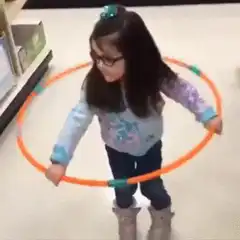 Girl hula hoops in store