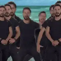 One Direction dancing on beach