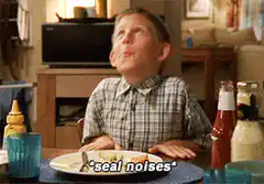 Boy making seal noises at dinner
