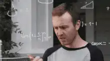 Guy explaining math equations